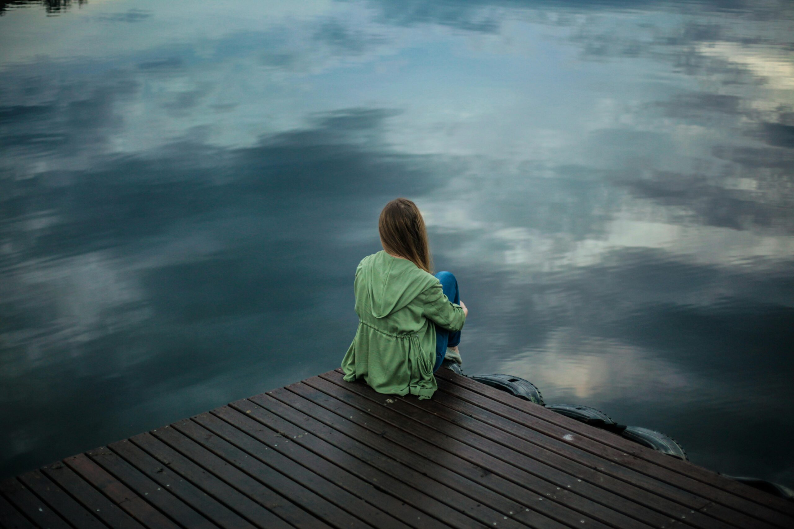 woman sitting looking into void