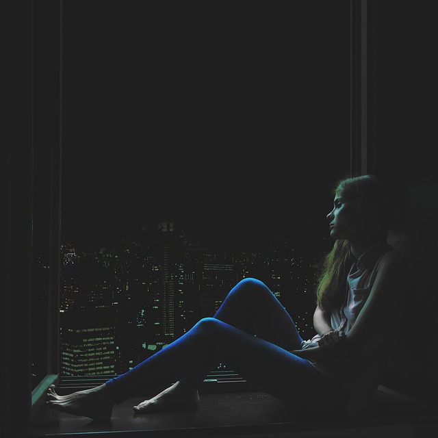 girl anxious window sill