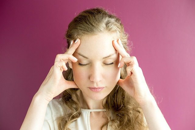 woman with migraine headache