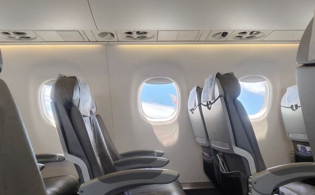 airplane cabin, seat, and window